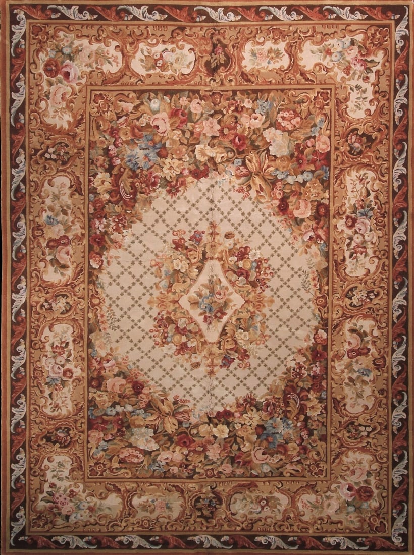 Vintage French Savonnerie Wool Area Rug 10x14 Beige Handmade: Vintage French Savonnerie Wool Area Rug 10x14 Beige Handmade This vintage French Savonnerie style area rug is handmade from high-quality wool and features a soft beige color palette with an intricate 