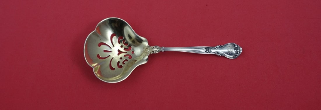 Gorham Chantilly Sterling Silver Pierced Confection Spoon 5.5": Gorham Chantilly Sterling Silver Pierced Confection Spoon 5.5" This exquisite Chantilly confection spoon by Gorham, crafted from sterling silver, showcases the elegant Chantilly pattern. This piece fe