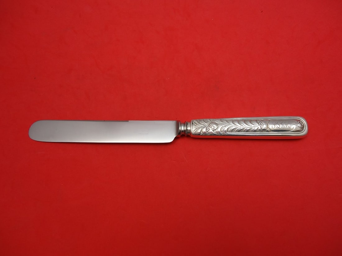 Tiffany & Co. Antique Floral Engraved Sterling Silver Dinner Knife 10": Tiffany & Co. Antique Floral Engraved Sterling Silver Dinner Knife 10" This elegant dinner knife by Tiffany & Co. features a stunning antique floral engraving, making it a unique addition to your flat