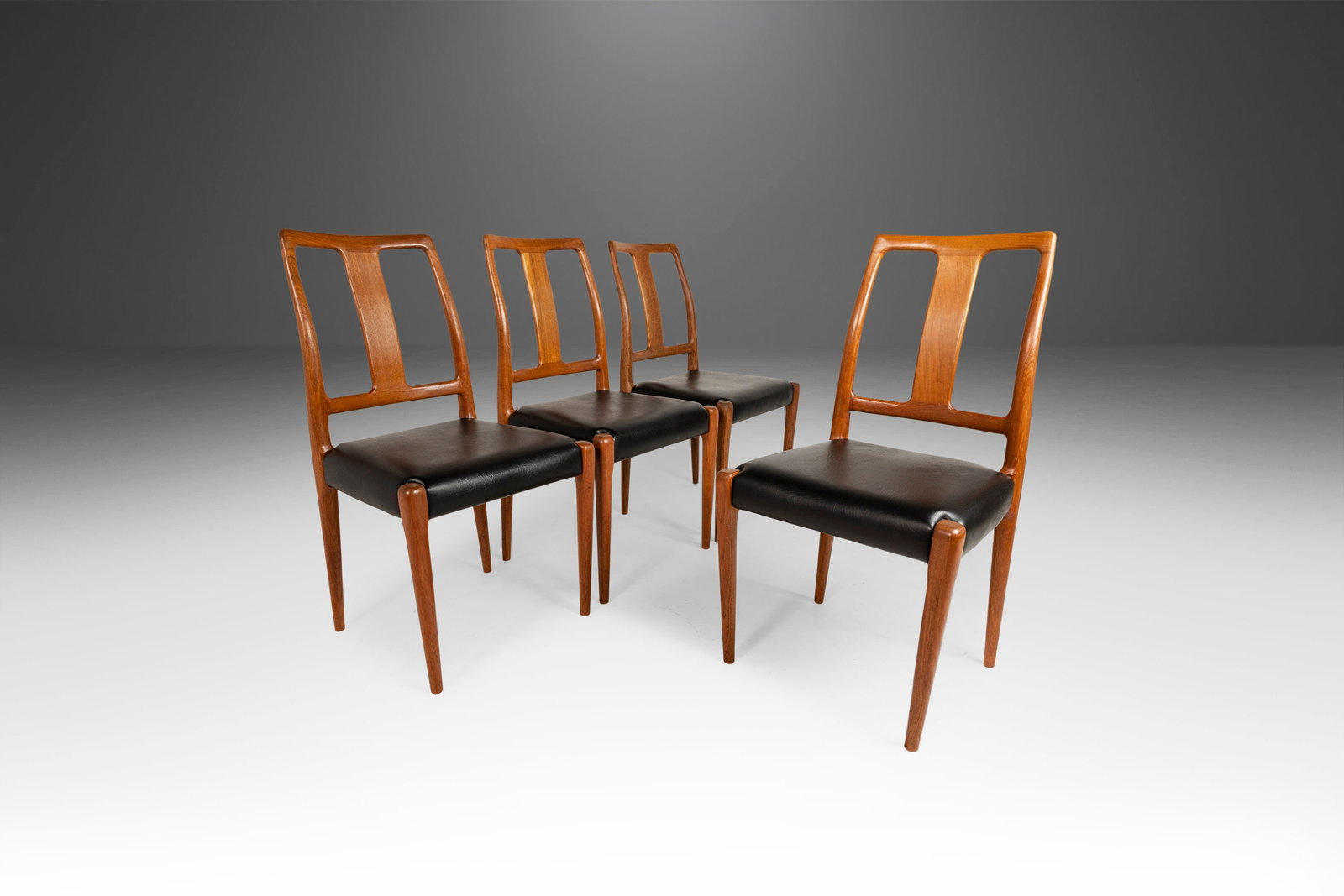 D-SCAN Set of 4 Teak Dining Chairs Black Vinyl 1970s Scandinavian Design: D-SCAN Set of 4 Teak Dining Chairs Black Vinyl 1970s Scandinavian Design Discover this stunning set of four teak dining chairs, expertly crafted by D-SCAN in the 1970s and newly upholstered in thick b