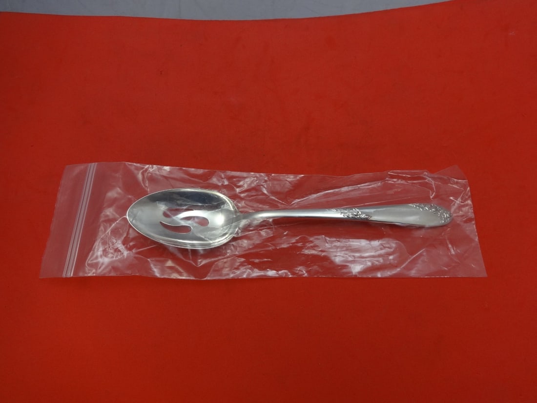 Lunt Sweetheart Rose Sterling Silver Slotted Serving Spoon 8 3/8" New: Lunt Sweetheart Rose Sterling Silver Slotted Serving Spoon 8 3/8" New This exquisite serving spoon features the elegant Sweetheart Rose pattern by Lunt, crafted from high-quality sterling silver. With
