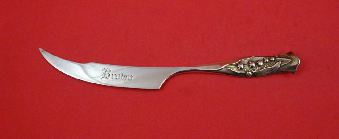 Sterling Silver Letter Opener Flora Pattern Lily of the Valley Motif 7 1/8": Sterling Silver Letter Opener Flora Pattern Lily of the Valley Motif 7 1/8" This Shiebler Flora letter opener is crafted from sterling silver and features a lily of the valley motif. It is monogrammed
