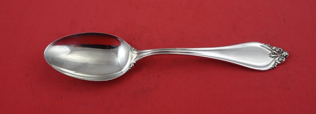 Reed and Barton La Perle Sterling Silver Serving Spoon 8 3/8": Reed and Barton La Perle Sterling Silver Serving Spoon 8 3/8" This exquisite serving spoon from the La Perle pattern by Reed and Barton showcases the timeless elegance of sterling silver craftsmanship