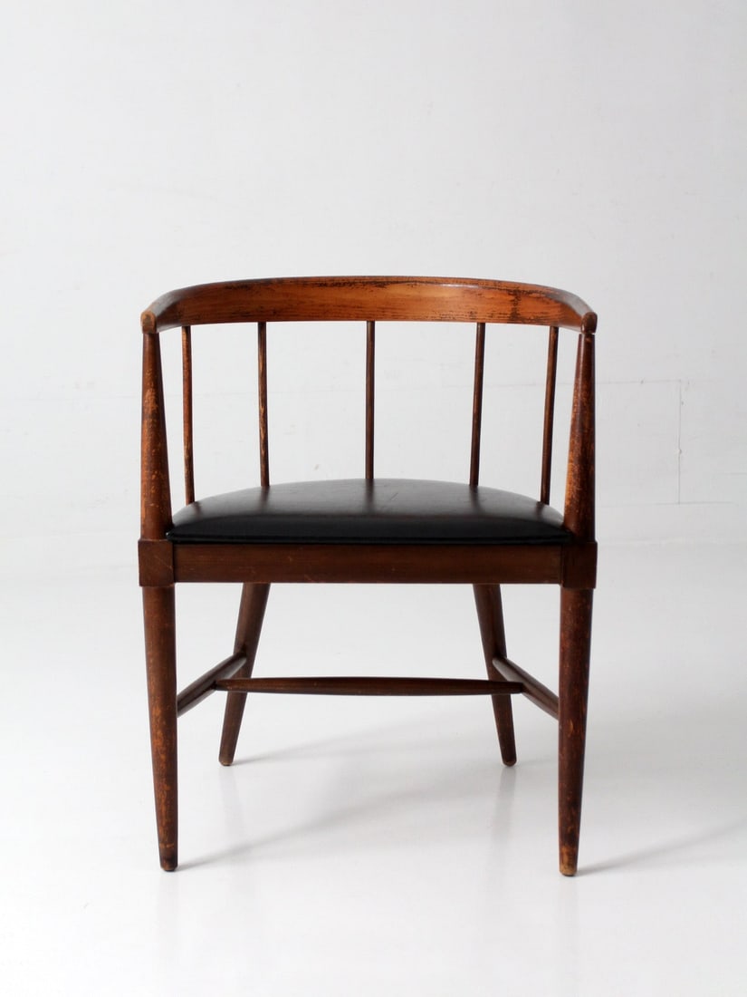 Spindle Back Accent Chair With Black Seat Mid Century Danish Style: Spindle Back Accent Chair With Black Seat Mid Century Danish Style This mid-century Danish modern spindle back chair features a gently curved rail and open, balanced proportions. The continuous wrapar