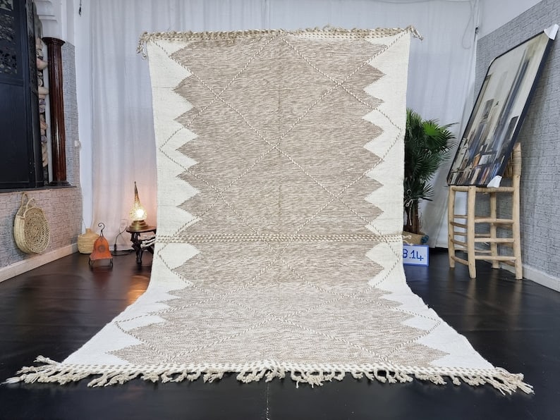 Authentic Handwoven Moroccan Rug 100% Sheep Wool 10 x 5 Feet: Authentic Handwoven Moroccan Rug 100% Sheep Wool 10 x 5 Feet Discover the beauty of this Fabulous Authentic Rug, handwoven in the Atlas Mountains by skilled local Berber women weavers. Crafted using t