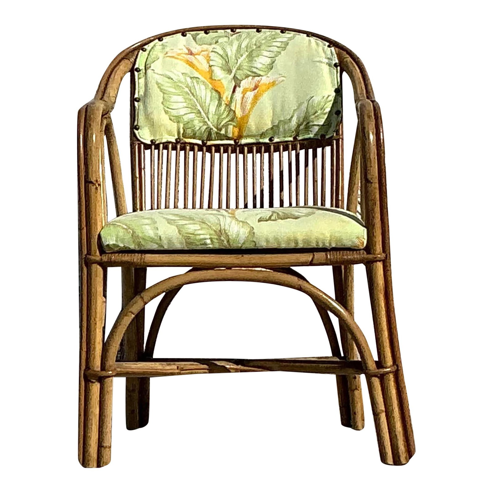 Vintage Coastal Rattan Lounge Chair with Botanical Cushions: Vintage Coastal Rattan Lounge Chair with Botanical Cushions Introduce a touch of tropical elegance to your home with this vintage coastal bent rattan lounge chair. Its beautifully curved rattan frame 