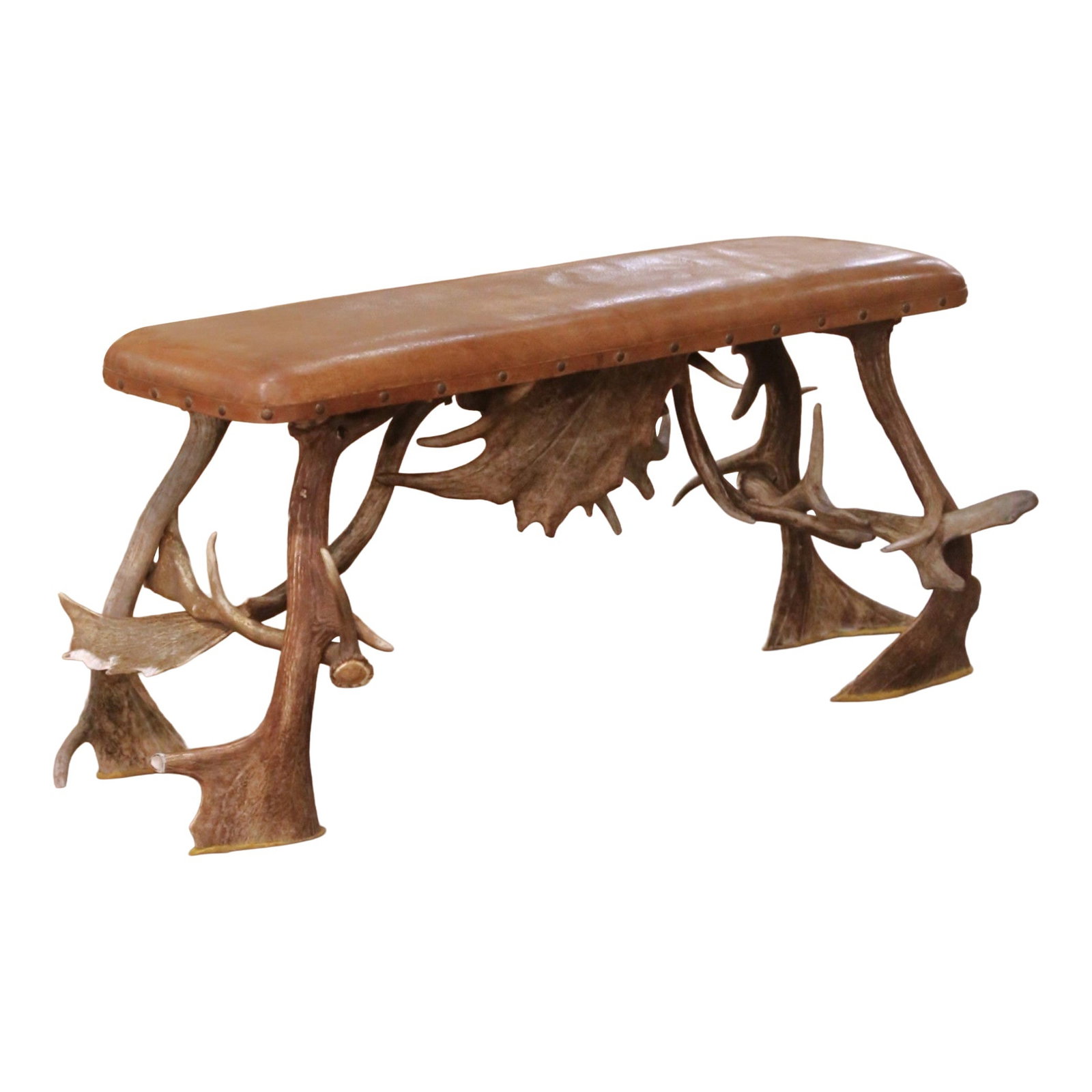 Austrian Black Forest Style Antler Bench with Patinated Leather Upholstery: Austrian Black Forest Style Antler Bench with Patinated Leather Upholstery This early 20th-century Austrian Black Forest bench features a dramatic hand-crafted base made from naturally shed deer antle