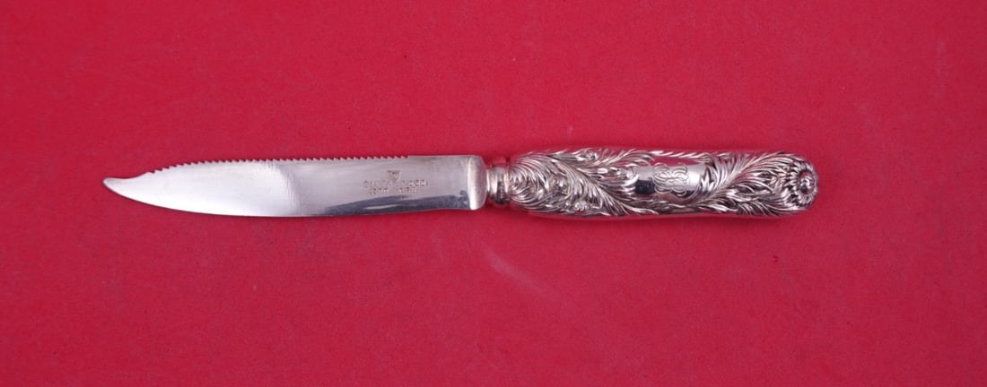 Tiffany Chrysanthemum Sterling Hollow Handle Citrus Knife 6 7/8: Tiffany Chrysanthemum Sterling Hollow Handle Citrus Knife 6 7/8 This is a Tiffany & Co. Chrysanthemum pattern sterling silver citrus knife featuring a hollow handle and a serrated, silver-plated blade