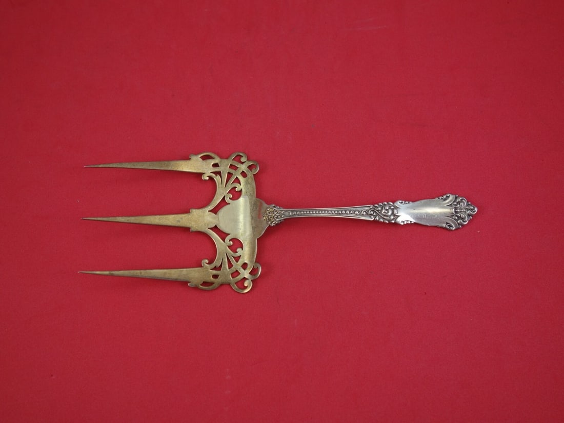 La Marquise Reed & Barton Sterling Silver Goldwashed Toast Fork 7.5 Inch: La Marquise Reed & Barton Sterling Silver Goldwashed Toast Fork 7.5 Inch This is a La Marquise sterling silver toast fork by Reed & Barton, featuring a goldwashed finish. Measuring 7 1/2 inches in len