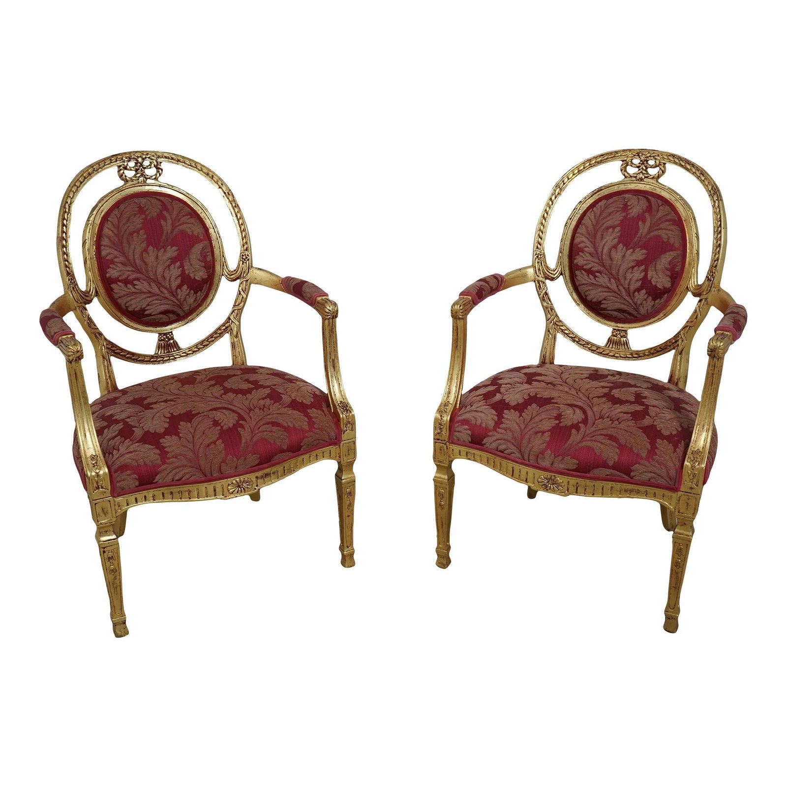 Elegant Pair of Gold Leaf French Louis XVI Open Armchairs: Elegant Pair of Gold Leaf French Louis XVI Open Armchairs This elegant pair of French Louis XVI style open armchairs showcases a stunning gold leaf finish with subtle red undertone highlights, adding 