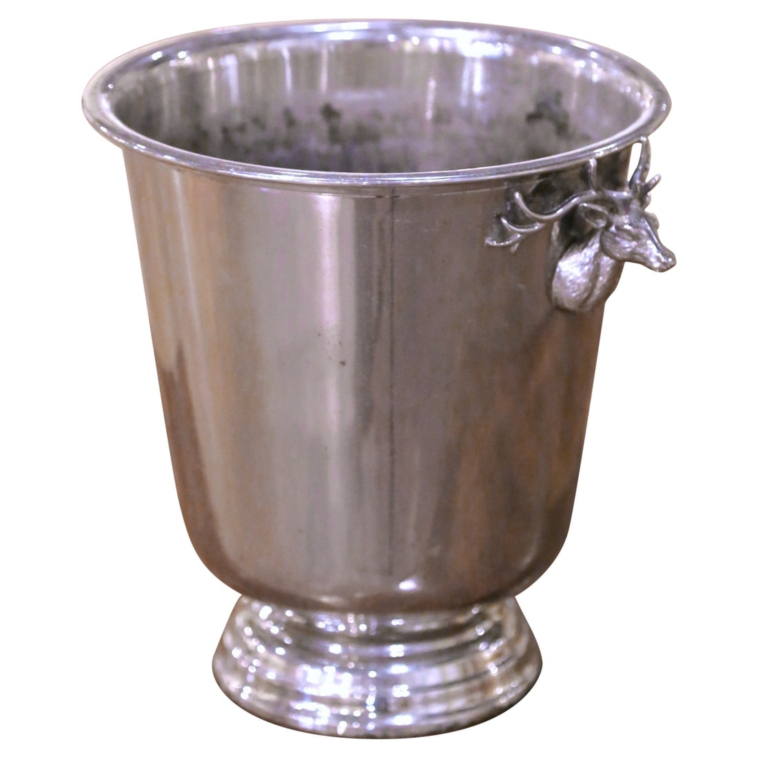 French Silvered Brass Champagne Cooler Stag Head Mounts: French Silvered Brass Champagne Cooler Stag Head Mounts This mid-century French champagne bucket, crafted circa 1950, features a tapered brass body with a silvered finish and is adorned with sculptura