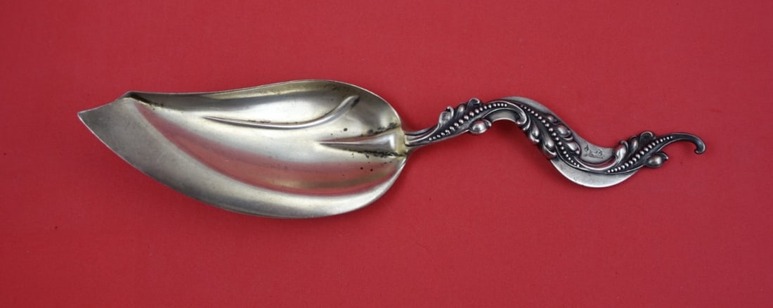 Sterling Silver Aspic Slice with Wave Handle by Shiebler 9 3/8 Inch: Sterling Silver Aspic Slice with Wave Handle by Shiebler 9 3/8 Inch This Shiebler sterling silver aspic slice features a unique wave-shaped handle with bead and scroll detailing. The piece measures 9 