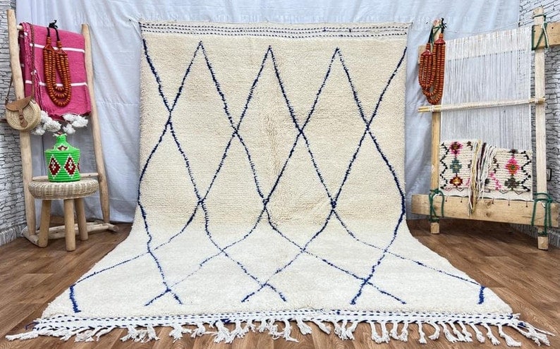 Authentic White Handwoven Rug from Morocco 8x5ft: Authentic White Handwoven Rug from Morocco 8x5ft This exquisite white authentic rug is handwoven in the Atlas Mountains by local Berber women weavers, utilizing traditional tools and natural local woo
