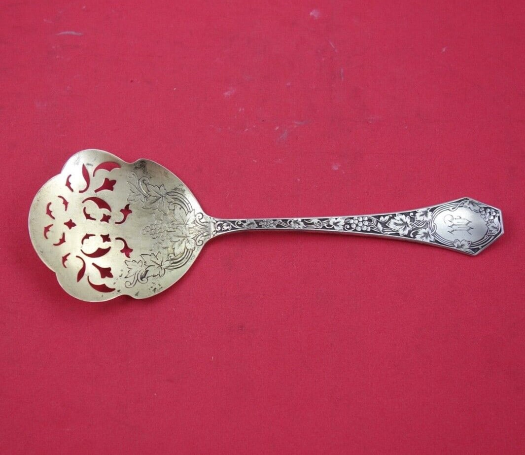SSMC-Saart Grape Sterling Silver Tomato Server Gold Wash 7 1/4": SSMC-Saart Grape Sterling Silver Tomato Server Gold Wash 7 1/4" This exquisite tomato server is part of the Grape pattern by SSMC-Saart. Crafted from high-quality sterling silver with a beautiful gold