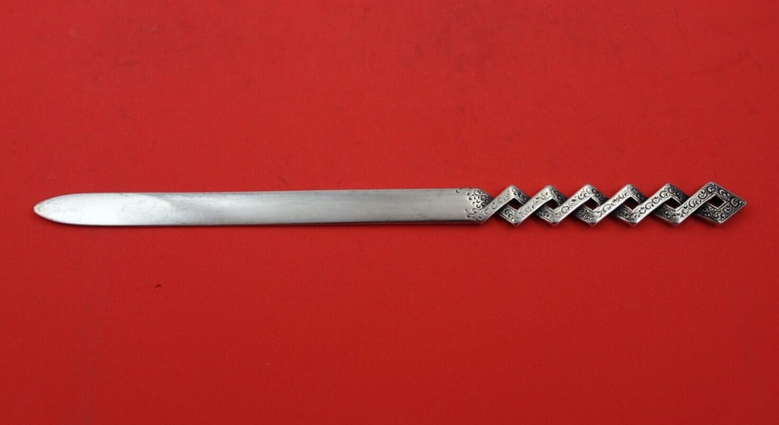 Shiebler Sterling Silver Paper Knife 10.5 inches Elegant Design: Shiebler Sterling Silver Paper Knife 10.5 inches Elegant Design This exquisite paper knife, crafted by Shiebler, showcases the elegance of sterling silver with a unique pierced and engraved geometric 