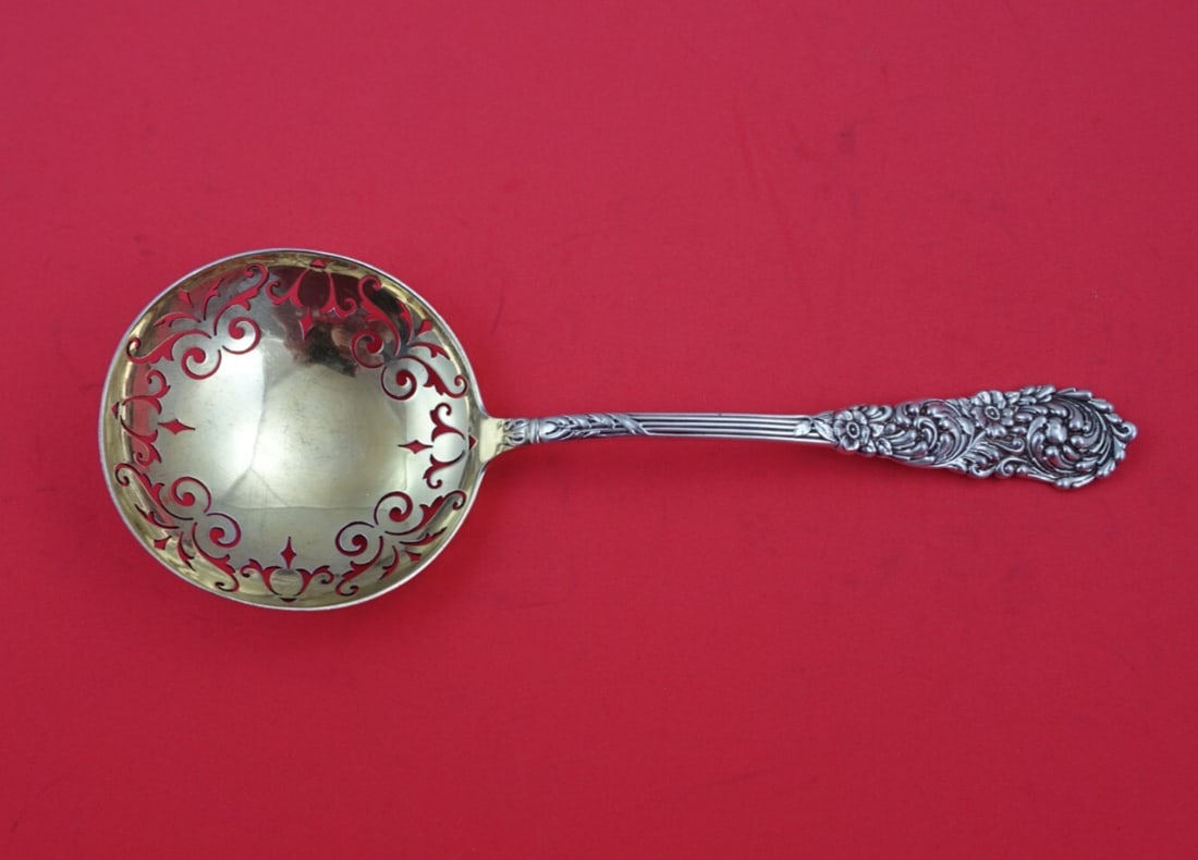 Reed and Barton Trajan Sterling Silver Gold-Washed Pea Spoon 8.25 In: Reed and Barton Trajan Sterling Silver Gold-Washed Pea Spoon 8.25 In This exquisite Trajan pea spoon from Reed and Barton features a stunning gold-washed finish and a beautifully pierced edge, making 