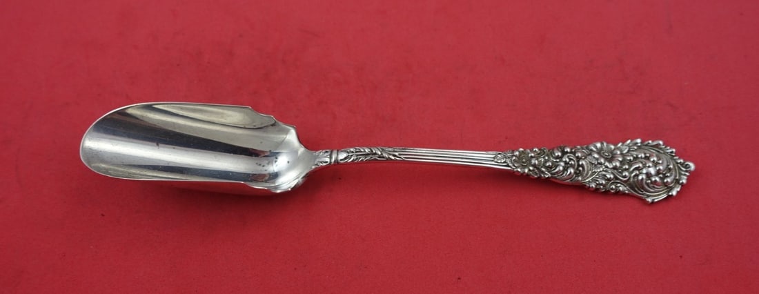 Reed & Barton Trajan Sterling Silver Cheese Scoop 7 3/4": Reed & Barton Trajan Sterling Silver Cheese Scoop 7 3/4" Discover the elegance of the Trajan pattern by Reed & Barton with this long sterling silver cheese scoop, measuring 7 3/4 inches. Crafted in po