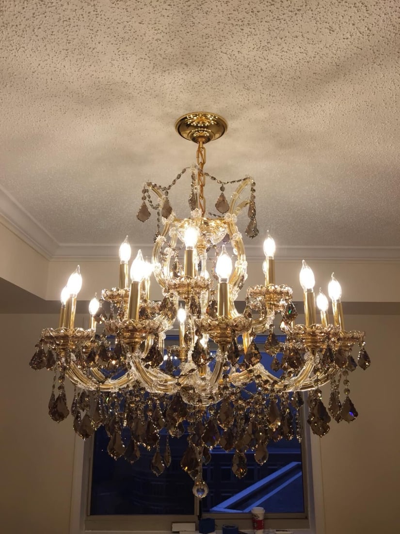 Artistry Maria Theresa 30 Inch Golden Teak Crystal Chandelier: Artistry Maria Theresa 30 Inch Golden Teak Crystal Chandelier Illuminate your dining space with this exquisite 30-inch Maria Theresa chandelier, featuring 19 Asfour crystals in a stunning golden teak 