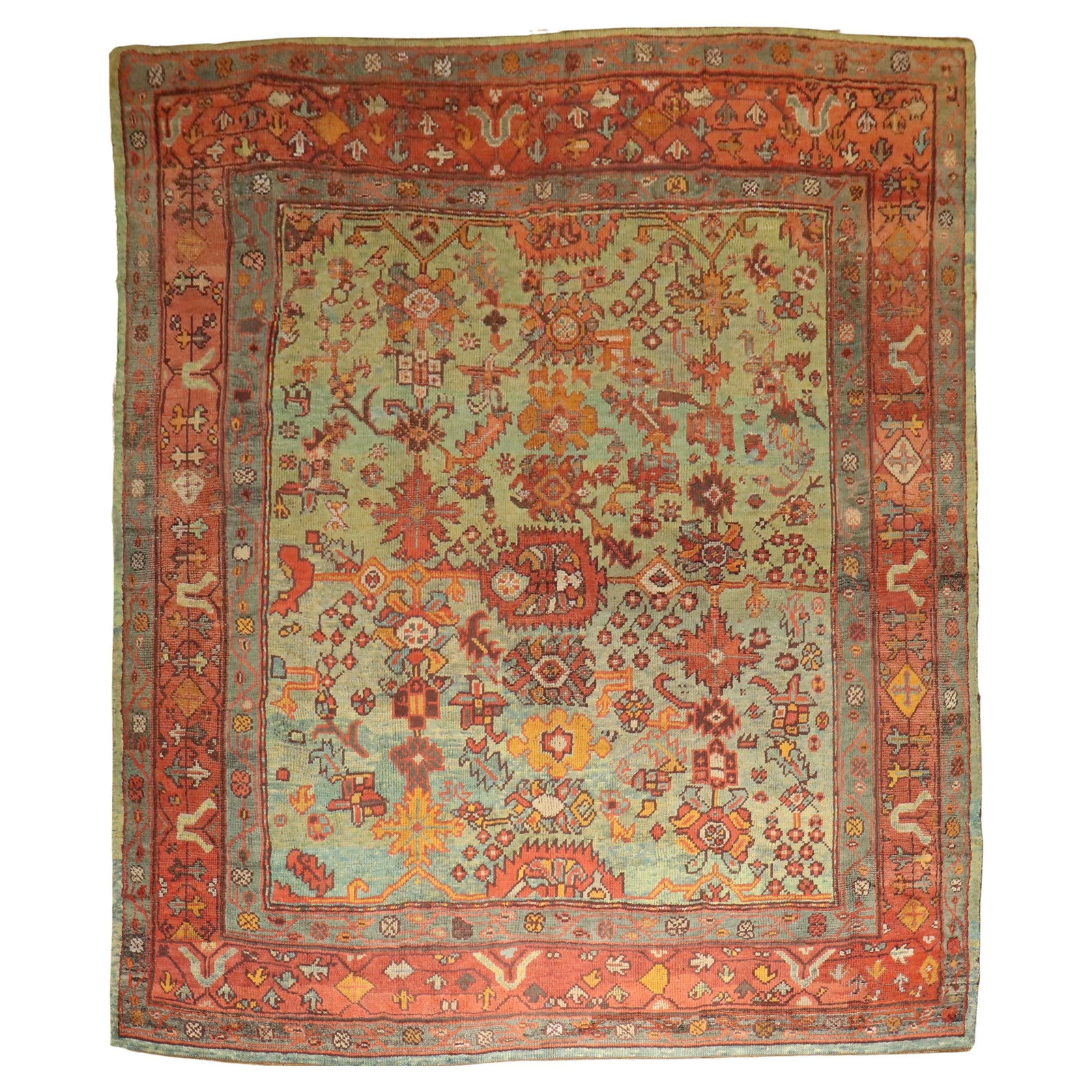 Early 20th Century Turkish Green Square Oushak Wool Rug 9'9" x 11': Early 20th Century Turkish Green Square Oushak Wool Rug 9'9" x 11' This antique square Oushak rug features a green ground and was hand-woven in Turkey in the early 20th century. Crafted from wool, it 