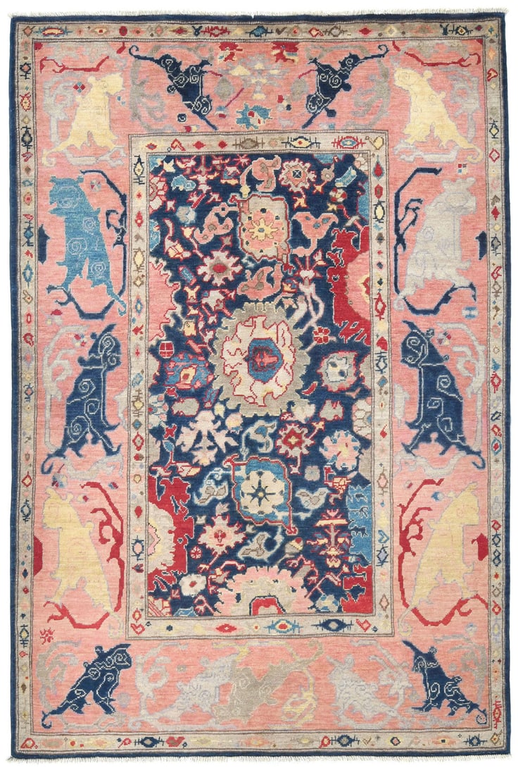 Hand-Knotted Wool Kazak Floral Area Rug 4'8 x 6'7: Hand-Knotted Wool Kazak Floral Area Rug 4'8 x 6'7 This handmade Kazak area rug from Central Asia features a modern floral pattern in a palette of dark navy, pink, cream, red, light blue, and brown. Ex