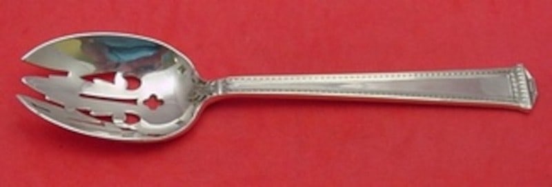 Tuttle Pantheon Sterling Silver Original Pierced Serving Spoon 8 1/4": Tuttle Pantheon Sterling Silver Original Pierced Serving Spoon 8 1/4" Sterling silver pierced serving spoon in the Pantheon pattern by Tuttle. This post-1940 piece was made in the United States, measu