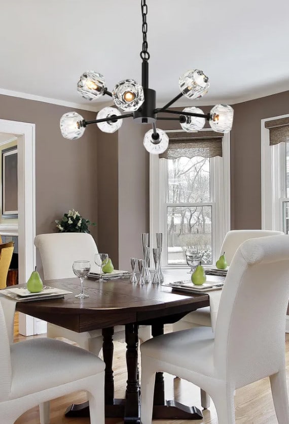 Black Crystal Sputnik Chandelier 8 Light Graham 24 Inch: Black Crystal Sputnik Chandelier 8 Light Graham 24 Inch This modern Sputnik-style chandelier features a striking black finish with eight lights and clear crystal shades, creating a bold and elegant st