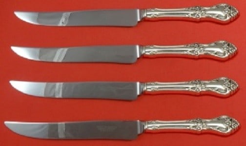 Oneida Afterglow Sterling Silver 4pc Steak Knife Set 9.5": Oneida Afterglow Sterling Silver 4pc Steak Knife Set 9.5" This exquisite Afterglow by Oneida steak knife set features four Texas-sized steak knives, each measuring 9 1/2". Crafted from high-quality st