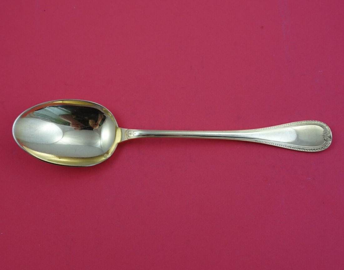 Christofle Malmaison Vermeil Silverplate Serving Spoon 9.75 Inch: Christofle Malmaison Vermeil Silverplate Serving Spoon 9.75 Inch Enhance your dining experience with this exquisite Malmaison Vermeil Serving Spoon by Christofle. Crafted in silverplate, this elegant 