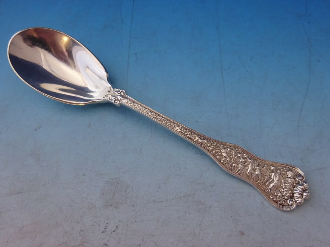 Tiffany & Co Olympian Sterling Silver Spade Ice Cream Spoon 6": Tiffany & Co Olympian Sterling Silver Spade Ice Cream Spoon 6" Indulge in elegance with the Olympian Ice Cream Spoon by Tiffany & Co. Crafted from high-quality sterling silver, this exquisite spoon fe