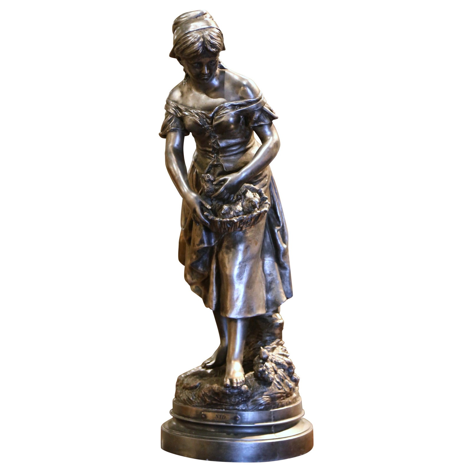 Le Nid Spelter Sculpture by L Gregoire French Neoclassical Female Figure with Birds: Le Nid Spelter Sculpture by L Gregoire French Neoclassical Female Figure with Birds This elegant 19th-century French neoclassical statue, titled "Le Nid" by L. Gregoire, depicts a young woman holding 