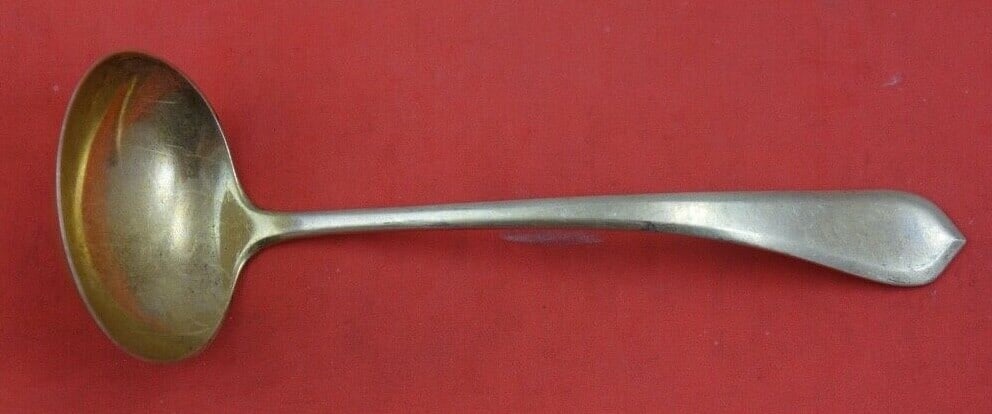 Gorham Old London Plain Sterling Silver Sauce Ladle Gold Wash 5 3/8": Gorham Old London Plain Sterling Silver Sauce Ladle Gold Wash 5 3/8" This exquisite sauce ladle features the classic Old London Plain pattern crafted by Gorham. Made from high-quality sterling silver,