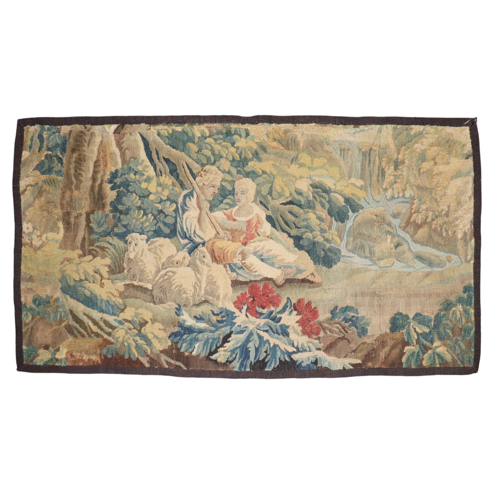 18th Century French Wool Tapestry Pastoral Shepherd and Sheep Scene: 18th Century French Wool Tapestry Pastoral Shepherd and Sheep Scene A French pastoral landscape tapestry from the 18th century, depicting a placid scene with a shepherd and shepherdess resting under a