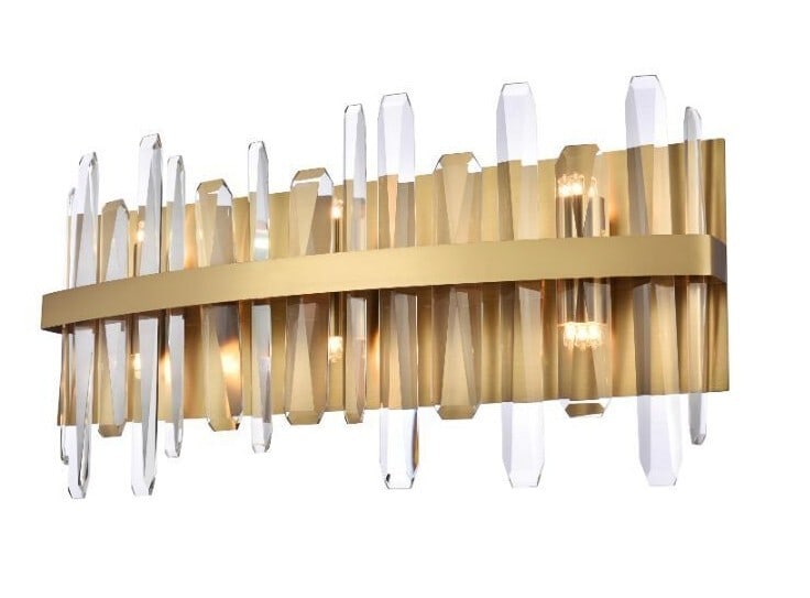 Serena 6 Light Crystal Wall Sconce Satin Gold 24": Serena 6 Light Crystal Wall Sconce Satin Gold 24" Modern 6-light wall sconce vanity fixture with a satin gold finish, clear crystal accents, and a rectangular shade shape. It is hardwired, designed fo