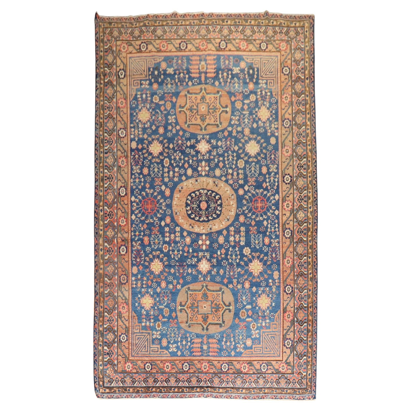 Early 20th Century Khotan Gallery Rug in Blue Wool 6' 10" x 13' 2": Early 20th Century Khotan Gallery Rug in Blue Wool 6' 10" x 13' 2" Early 20th century Samarkand Khotan rug in rich blue, presented in a Bohemian style. It is hand-woven from wool and originates from E