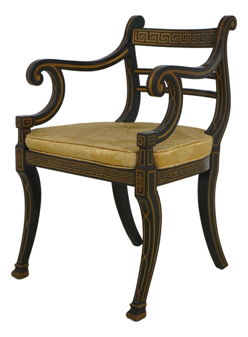 Regency Inspired Black and Gold Cane Armchair with Custom Cushion: Regency Inspired Black and Gold Cane Armchair with Custom Cushion This Regency style chair features a black and gold finish with elegantly scrolled arms and Greek key painted detailing. It is construc
