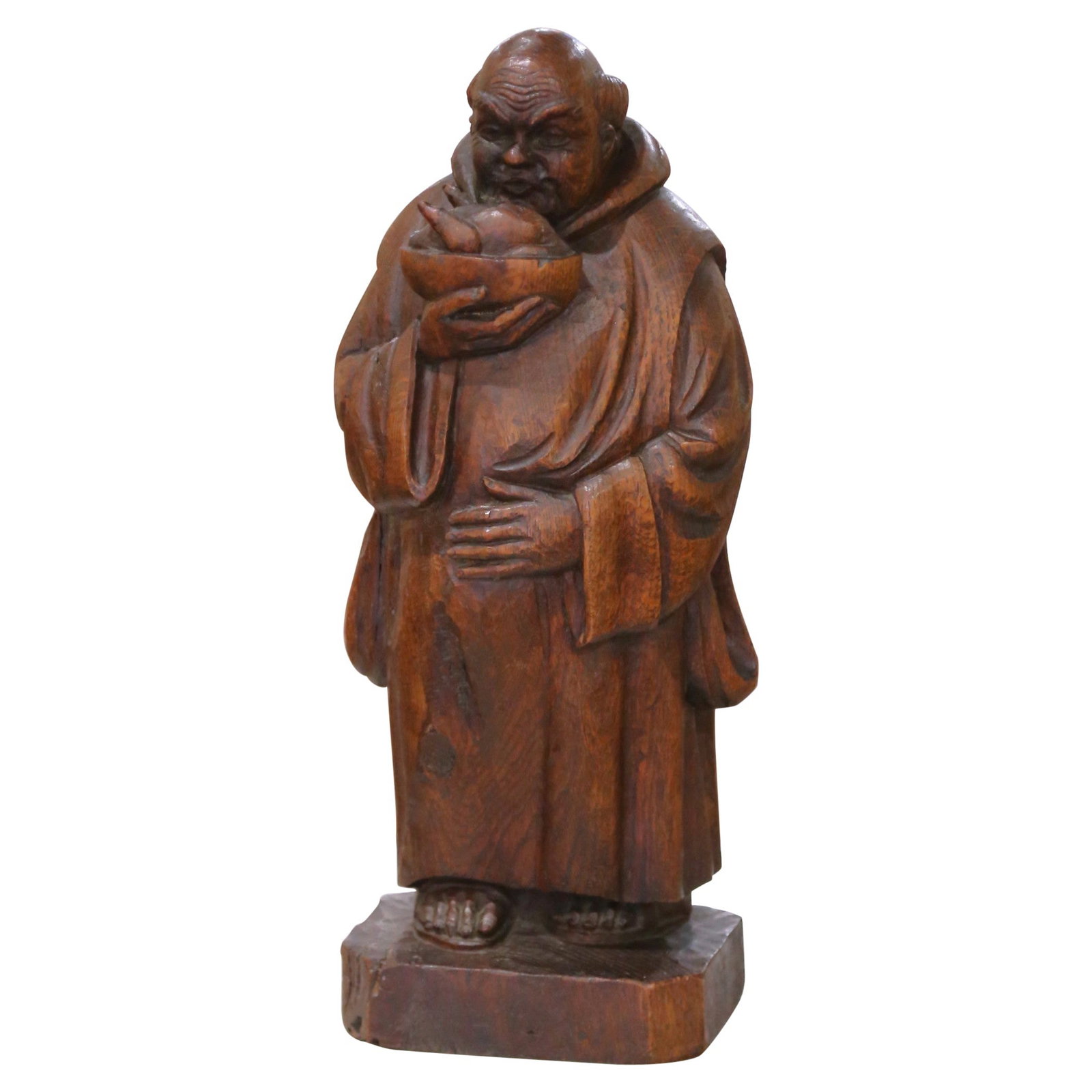 19th Century French Hand-Carved Oak Gothic Monk Figure with Bowl: 19th Century French Hand-Carved Oak Gothic Monk Figure with Bowl This exquisite 19th-century French hand-carved oak figure presents a solemn monk dressed in a Gothic style robe, holding a bowl that sy