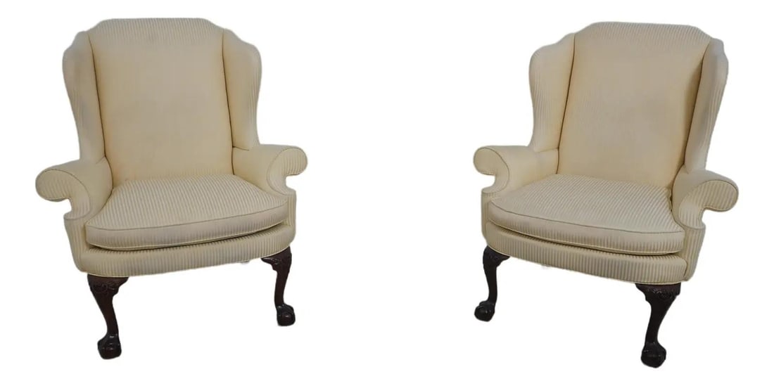 Southwood Mahogany Wing Back Chairs Pair Ball and Claw Feet: Southwood Mahogany Wing Back Chairs Pair Ball and Claw Feet This pair of Southwood wing back easy chairs features a classic Chippendale style with ball and claw feet, carved knees, and traditional des