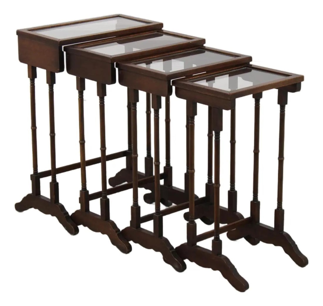 Brandt Mahogany Quartetto Nesting Table Set of 4: Brandt Mahogany Quartetto Nesting Table Set of 4 This vintage set of four Brandt nesting tables features graduated sizes and is crafted from mahogany with glass tops. Part of the Quartetto Collection,