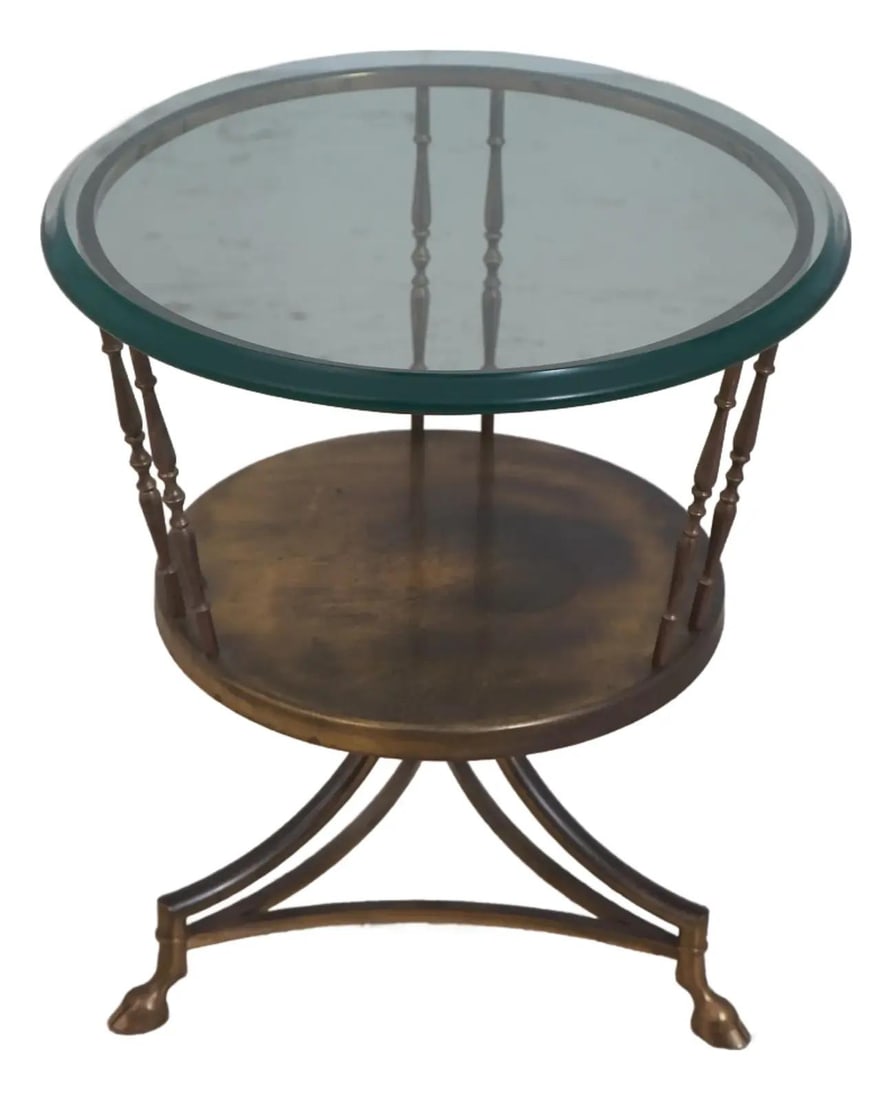 Regency Inspired Brass and Glass Side Table with Beveled Top and Hoof Feet: Regency Inspired Brass and Glass Side Table with Beveled Top and Hoof Feet This vintage Regency style occasional table features a beveled glass top and a sturdy brass base with hoof feet. The table di
