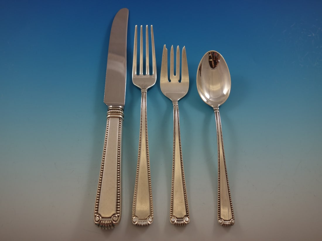 Blackinton Scroll and Bead Sterling Silver Flatware Set 51 pcs for 12: Blackinton Scroll and Bead Sterling Silver Flatware Set 51 pcs for 12 Enhance your dining experience with the elegant Scroll and Bead Sterling Silver Flatware Set by Blackinton. This exquisite 51-piec