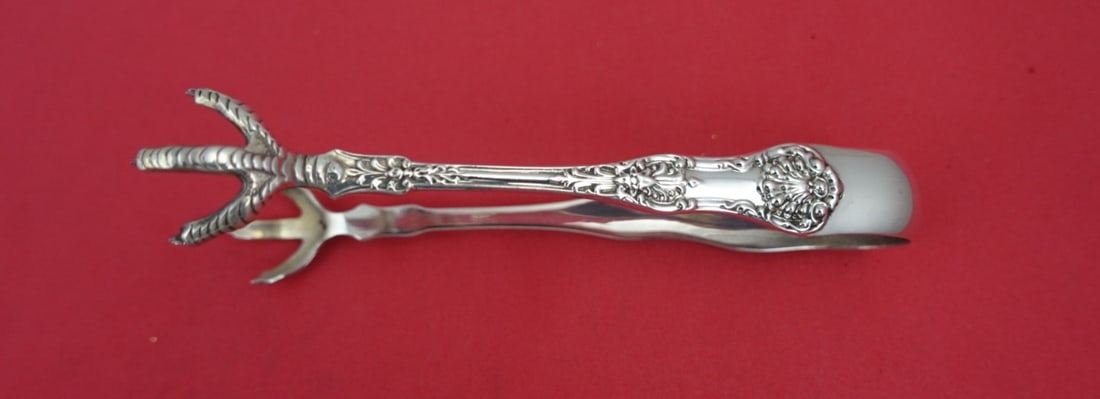 Dominick & Haff New King Sterling Silver Sugar Tong 5": Dominick & Haff New King Sterling Silver Sugar Tong 5" This exquisite 5" sugar tong, crafted by Dominick & Haff, features the elegant New King pattern. Made of high-quality sterling silver, this servi
