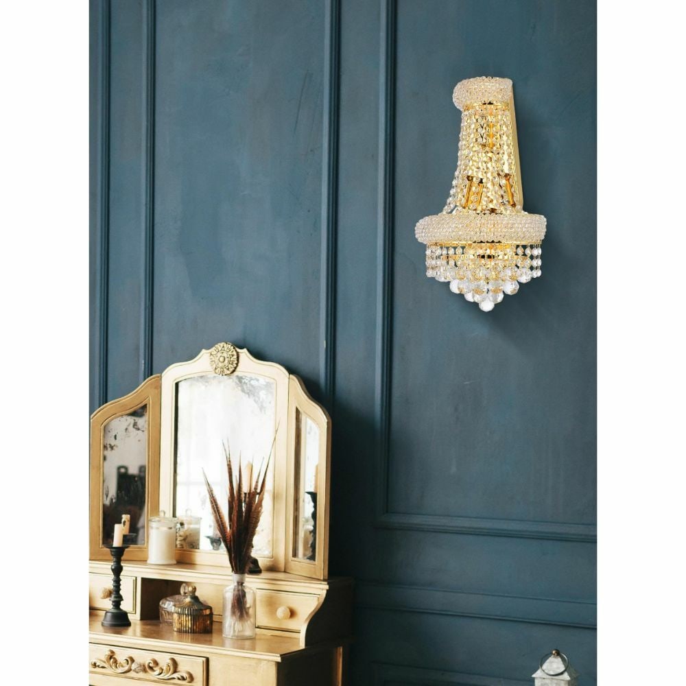 Primo 4-Light Gold Crystal Wall Sconce 17 in: Primo 4-Light Gold Crystal Wall Sconce 17 in Modern 4-light wall sconce in a gold finish with Royal Cut crystals and clear crystal glass. It is hardwired for indoor installation and features downward 