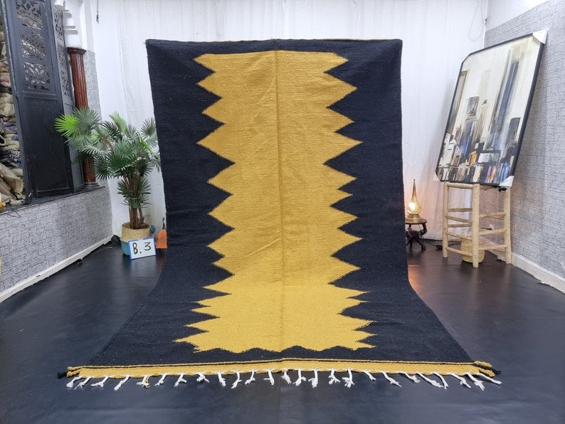 Authentic Handwoven Black and Yellow Moroccan Rug 8 x 5 Feet: Authentic Handwoven Black and Yellow Moroccan Rug 8 x 5 Feet This Elegant Black & Yellow Rug is a stunning piece handwoven in the Atlas Mountains by skilled Berber women weavers. Crafted using traditi