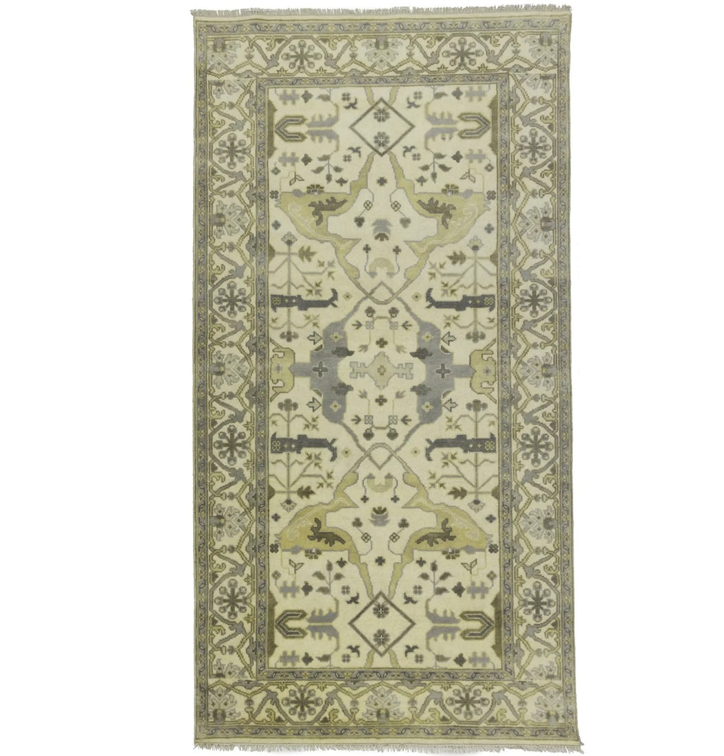 Hand Knotted Wool Oushak Runner 6'1 x 11'8 Floral Pattern: Hand Knotted Wool Oushak Runner 6'1 x 11'8 Floral Pattern This is an oversized handmade Oushak runner rug crafted from wool, featuring a floral pattern in muted tones of cream, taupe, and beige. The r