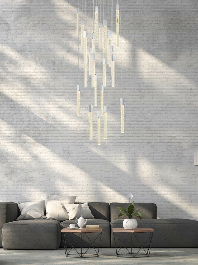 Weston 25 Light Chrome Crystal Pendant Chandelier 42 in: Weston 25 Light Chrome Crystal Pendant Chandelier 42 in Modern chrome crystal pendant chandelier with a 25-light design and clear seeded crystal bar details. It features a polished finish, downward li