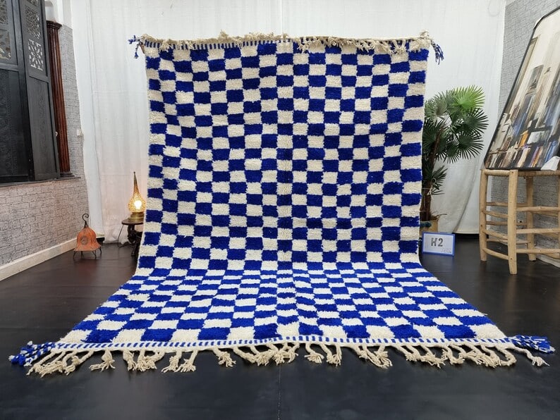 Authentic Handwoven White & Blue Moroccan Rug 8 x 5 Feet: Authentic Handwoven White & Blue Moroccan Rug 8 x 5 Feet Experience the beauty of authentic craftsmanship with this White & Blue Rug, handwoven in the Atlas Mountains by local Berber women weavers. Ma