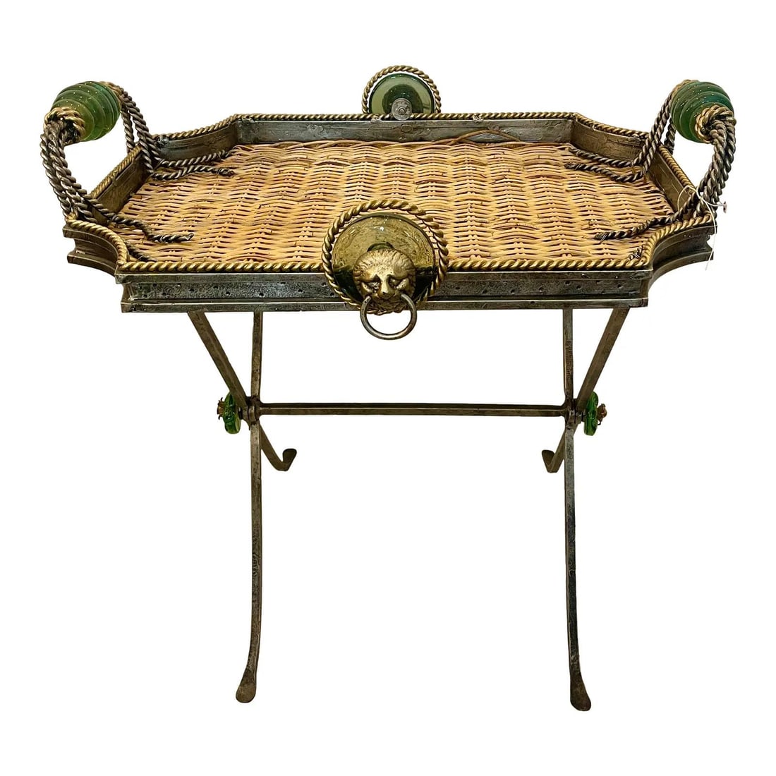 Maitland Smith wicker tray table with folding stand: Maitland Smith wicker tray table with folding stand This vintage tray table features a central wicker tray supported by a heavy metal frame, attributed to Maitland Smith. The tray is accented with dis
