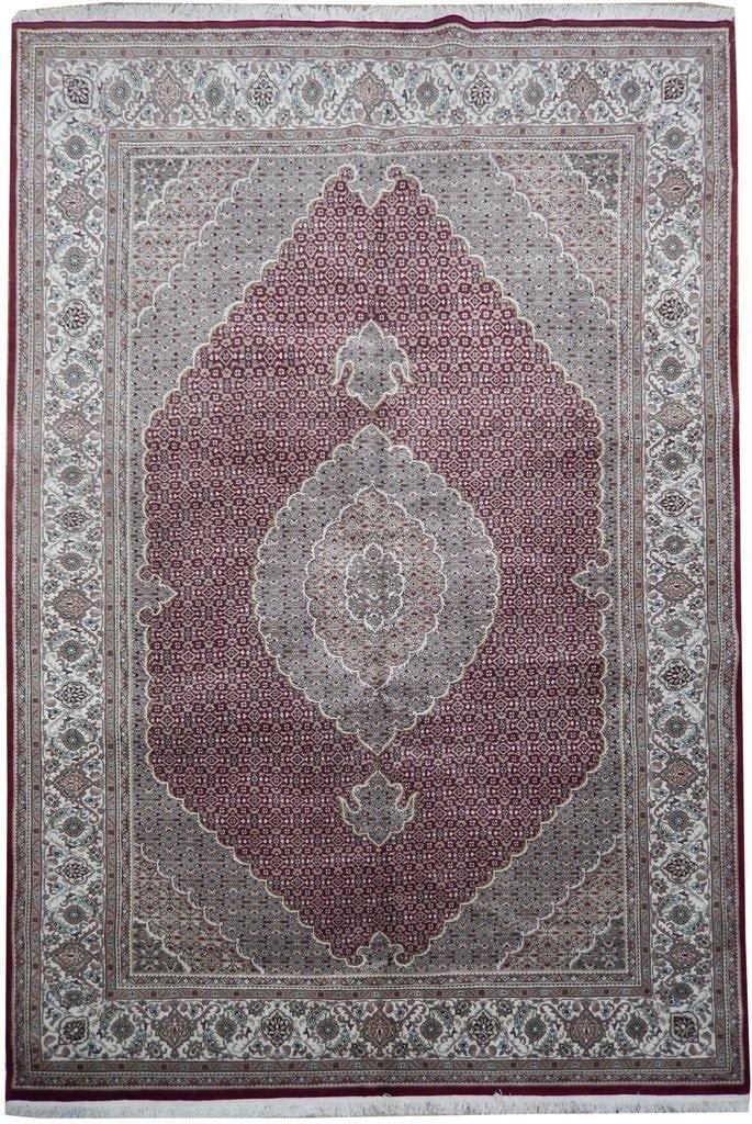 Handmade 6'9 x 10 Tabriz Mahi Wool Silk Rug: Handmade 6'9 x 10 Tabriz Mahi Wool Silk Rug Free continental US Shipping Enhance your living space with this stunning handmade Ruby Red Wool & Silk Tabriz Mahi Rug. Featuring bold geometric and classi