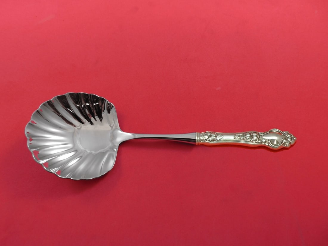 Wallace Violet Sterling Silver Berry Spoon Custom Made Shell Bowl 10 3/8 in: Wallace Violet Sterling Silver Berry Spoon Custom Made Shell Bowl 10 3/8 in This exquisite berry spoon is part of the "Violet" pattern by Wallace, showcasing a stunning shell-shaped bowl. Crafted from