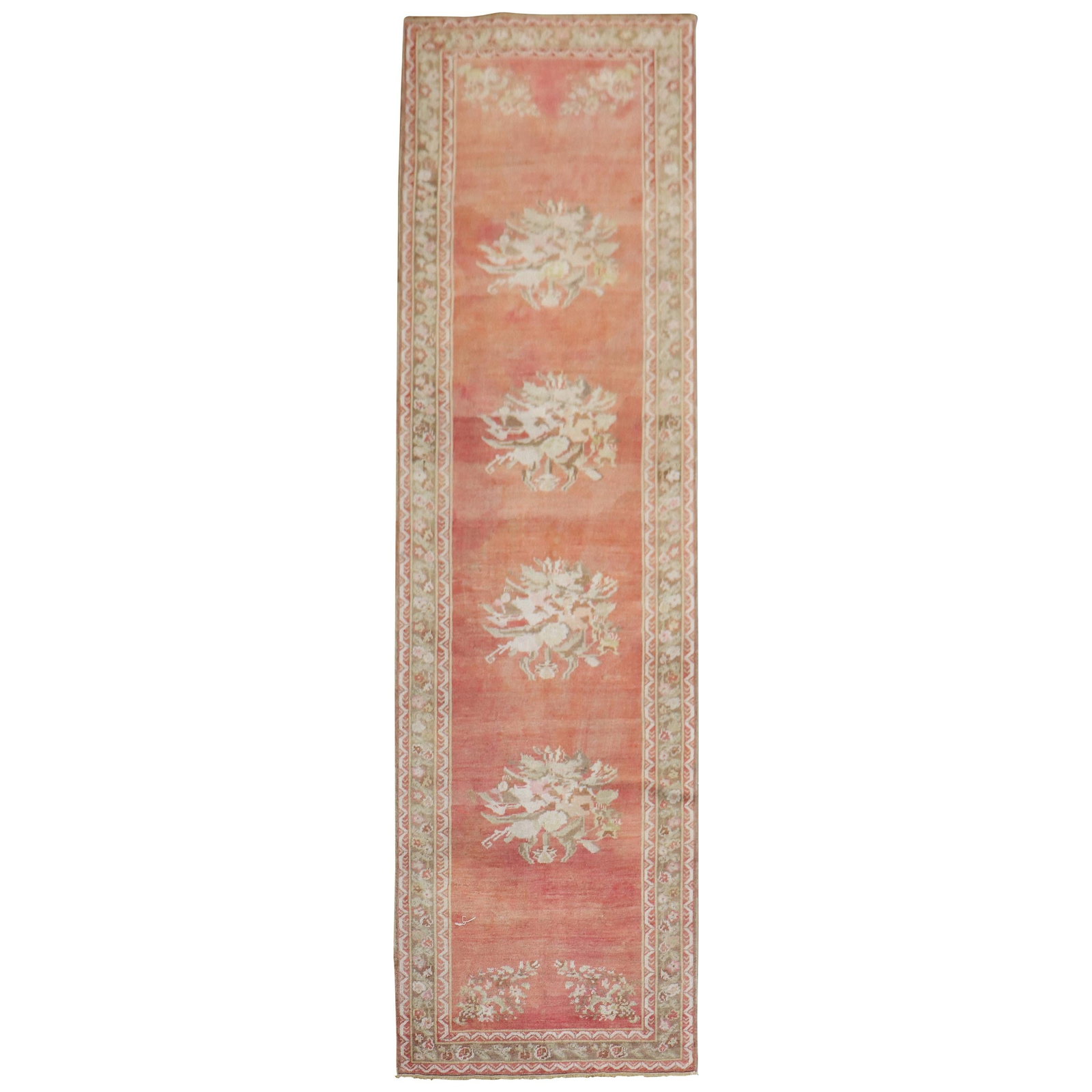 Melon Red Turkish Ghiordes Floral Wool Runner: Melon Red Turkish Ghiordes Floral Wool Runner This stunning early 20th century Turkish Ghiordes runner features a captivating floral motif set against a melon red background. Hand-knotted from high-qu